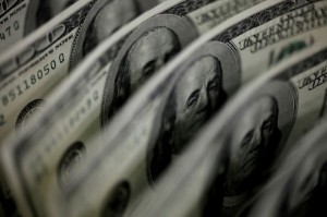 Picture of Dollar holds near five-day low; kiwi dollar picks up after hawkish comments