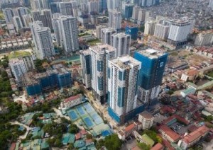 Ảnh của Rủi ro kép “bóp nghẹt ” thị trường bất động sản