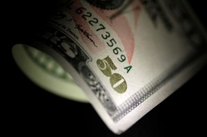 Picture of Dollar Edges Higher but Set for Losing Week; China Cuts Key Rate