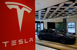 Tesla shares record rare jump this month on the way to worst year