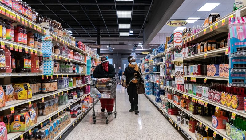 U.S. consumers shrug off high inflation, lean on savings to boost spending