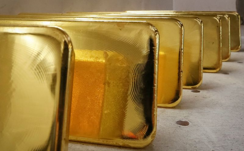 Gold Up, Hits Over One-Week High as Dollar Falls