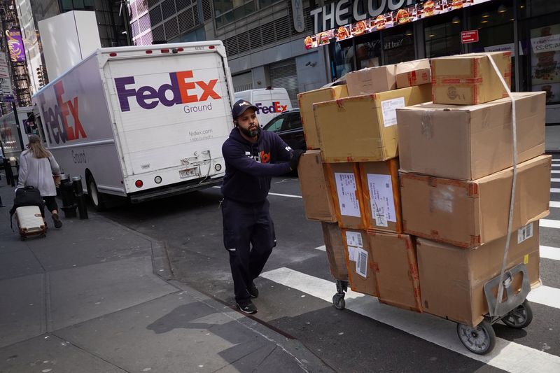 FedEx profit rises as volume softens, shares up