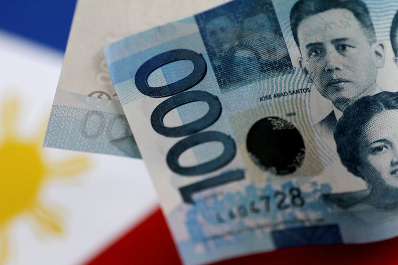 Philippine cenbank's modest rate-hike stance lifts bearish bets on peso- Reuters poll