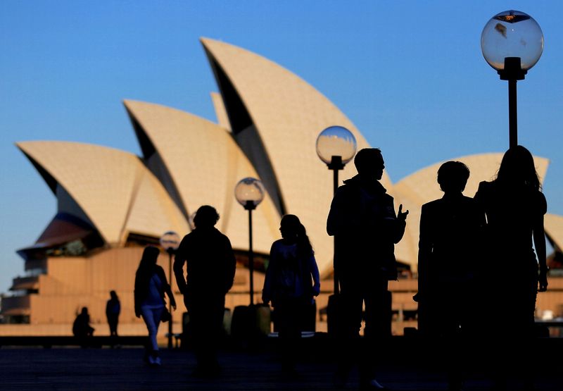 Australia cuts growth outlook as inflation bites