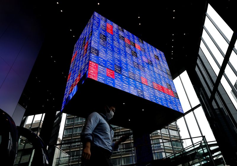 Asian stocks rise on upbeat data, Fed hawks lift dollar