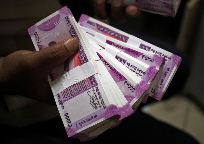 More trouble ahead for bruised Indian rupee - Reuters poll