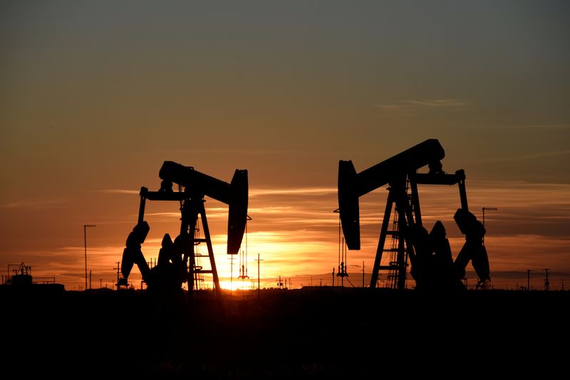 Oil drops, but poised for biggest weekly gain since early Oct