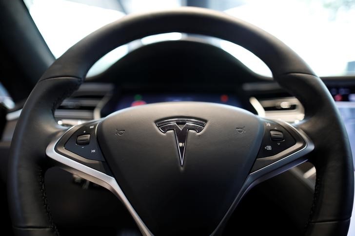 Tesla implements a hiring freeze, could cut more jobs next quarter - report