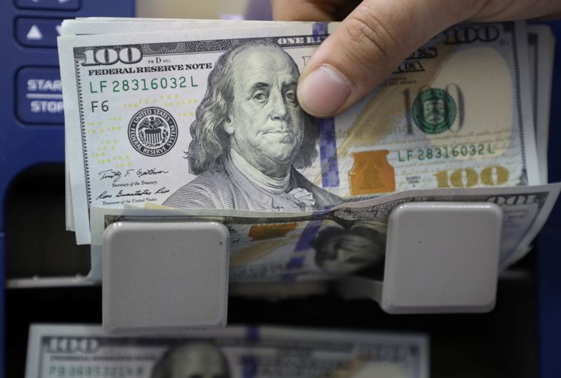 Dollar stands tall before Fed minutes; kiwi volatile