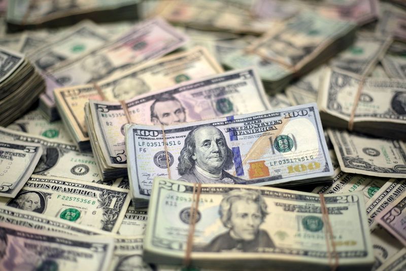 Dollar climbs as Evergrande uncertainty swirls