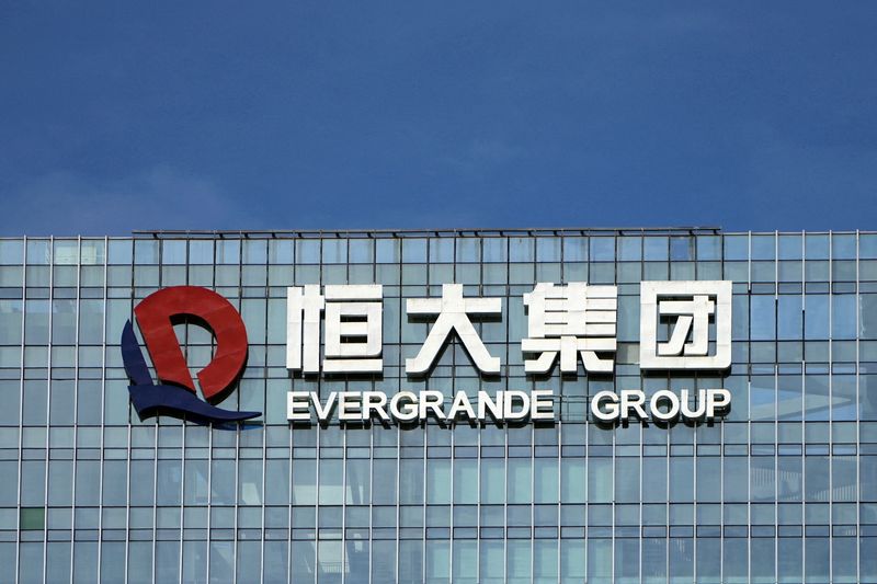 China Evergrande shares climb after winning bond payment delay